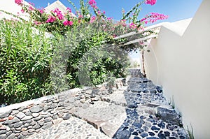 Ancient stone stairs and narrow street on Santorini island