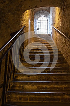 Ancient Stone Stairs and Window with Iron Grates, Cremona, Italy