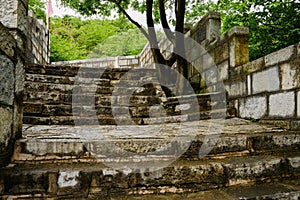 Ancient stone stairway of hillside wall with battlements