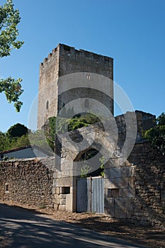 Ancient stone tower and building. Entrance and walls. Blue sky, no people. Merindades, Burgos, Spain,