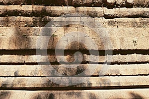 Ancient stone wall. The stonework of an old abandoned building. Background