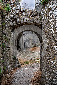 Ancient stone walls with arched passage in Rozafa Castle in Shkoder, Albania