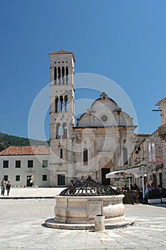 Ancient stone well and cathedral in Hvar, Croatia