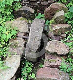 Ancient stone wheel of abandoned water mill to grind flour