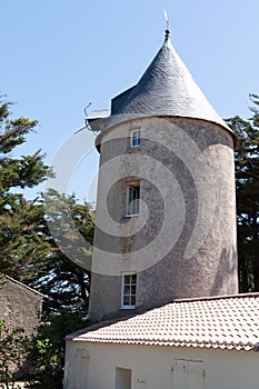 Ancient stone windmill typical in island of Noirmoutier Vendee France