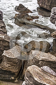 Ancient stones on agitated sea photo