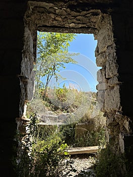 Ancient stones of the fortress wall. Ruins of an old fortress on top of a mountain. Historical fort on a mountain by the sea.