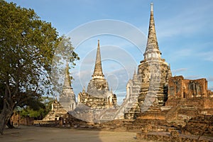 The ancient stupas of the buddhist temple of Wat Phra Si Sanphet on a sunny morning. Ayutthaya, Thailand