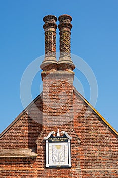 Ancient Sundial and chimney stack on the Moot Hall in Aldeburgh.