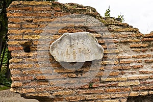 An ancient tablet of ancient times on on which in Latin is written Clivo Palatino - the name of the ancient road in Rome to the