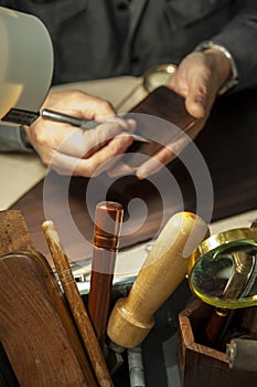 The ancient technique of etching. Engraving of the plate.