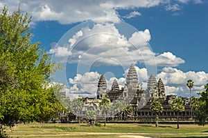 Ancient temple Angkor wat on a sunny day with blue skay and man