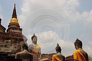 Ancient Temple With Buddhas Statue And Cloudy Sky