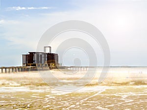 ancient temple when ebb tide burning sunshine on the sea photo