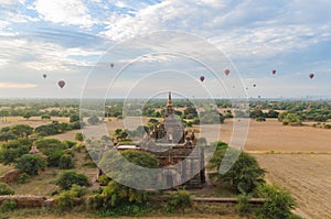 Ancient temple with hot air balloon in Bagan (Pagan).