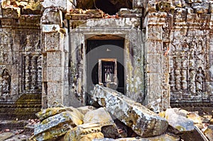 Ancient temple stone wall and entrance ruins, Angkor Wat