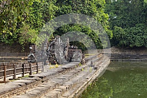 Ancient temple in tropical landscape, Angkor Wat complex. Buddhist or hindu temple Neak Pean with pond and trees.