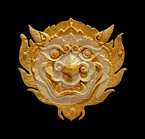 Ancient Thai art golden lion-singha isolated on black background