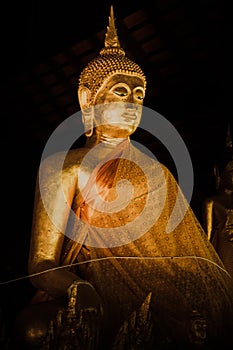 Ancient thai golden buddha in night.
