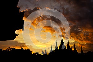 Ancient Thai temple silhouette in twilight sky background