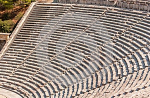 Ancient theater Epidaurus, Argolida, Greece close-up on rows photo