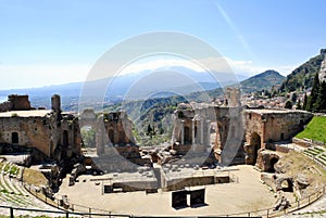 The Ancient Theatre of Taormina with Etna Mountain in background