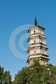 Ancient tower closeup against a blue sky
