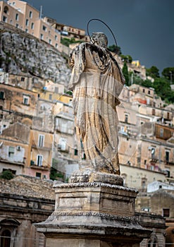 Ancient town Modica and sculptures of the church or Dome of San Pietr , Sicily, Italy