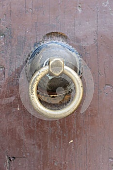 Ancient traditional wooden door with bronze door knob in Stone Town on island Zanzibar, Tanzania, East Africa