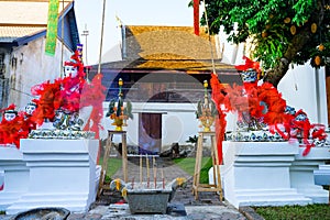 Ancient Tripitaka Hall Building and Old Lanna Style Statues in Ket Karam Temple