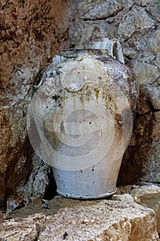 ancient vase or amphora or jar in the cavern ruin