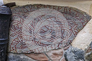 Ancient Viking rune built into a wall in Gamla Stan Old Town of Stockholm, Sweden