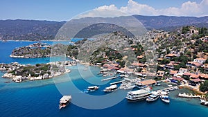 Ancient village of Simena (Kaleköy) beach and yachts