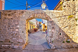 Ancient village of Sukosan near Zadar stone street and arch gate