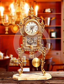 Ancient vintage brass pendulum clock