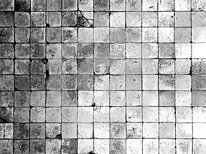 Ancient vintage cracked square tile floor or wall for background and texture, black and white tone