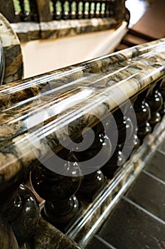 Ancient vintage marmoreal marble stairs with balusters in daylight
