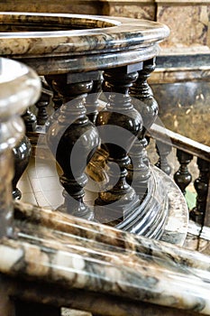 ancient vintage marmoreal marble stairs with balusters in daylight