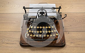 Ancient vintage portable typewriter with non qwerty keyboard photo