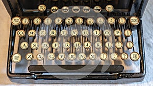 Ancient vintage portable typewriter with qwerty keyboard photo