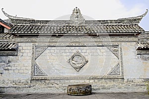 Ancient wall with bas-relief of Chinese mansion