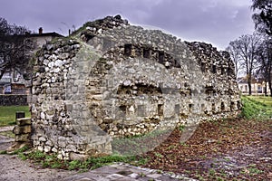 Ancient wall with gun-points as part of outer defense of ancient city fortress