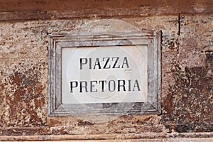 Ancient wall plate with name of city square `Piazza Pretoria`. Palermo, Sicily