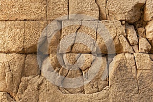 Ancient wall texture of cracked stone blocks