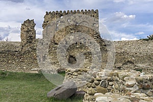 Ancient wall,tower ruins and millstone