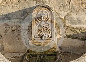 ancient water fountain pipes carved in stone