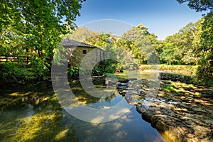 Ancient Water mill in Tamuxe or Carballas River in O Rosal. photo