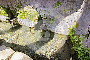 Ancient water, mountain spring built of stone brick in the mountains of Tartous city, Syria.