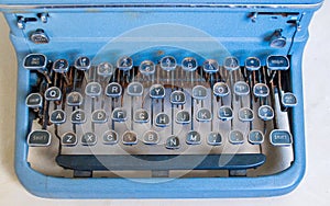 Ancient weathered manual typewriter with rusted keys
