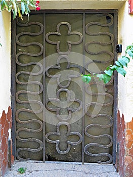 An ancient weathered stylish old wooden door